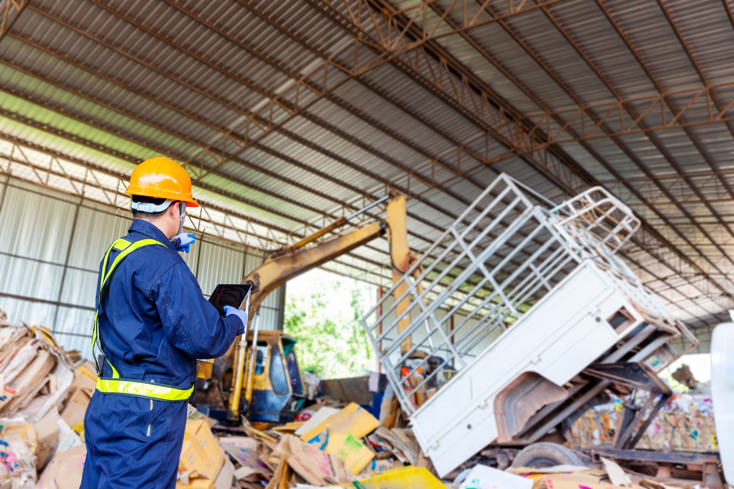 Engineer driving a loader in the recycling plant.