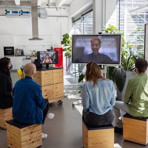 Group of co-workers participating in a virtual training.