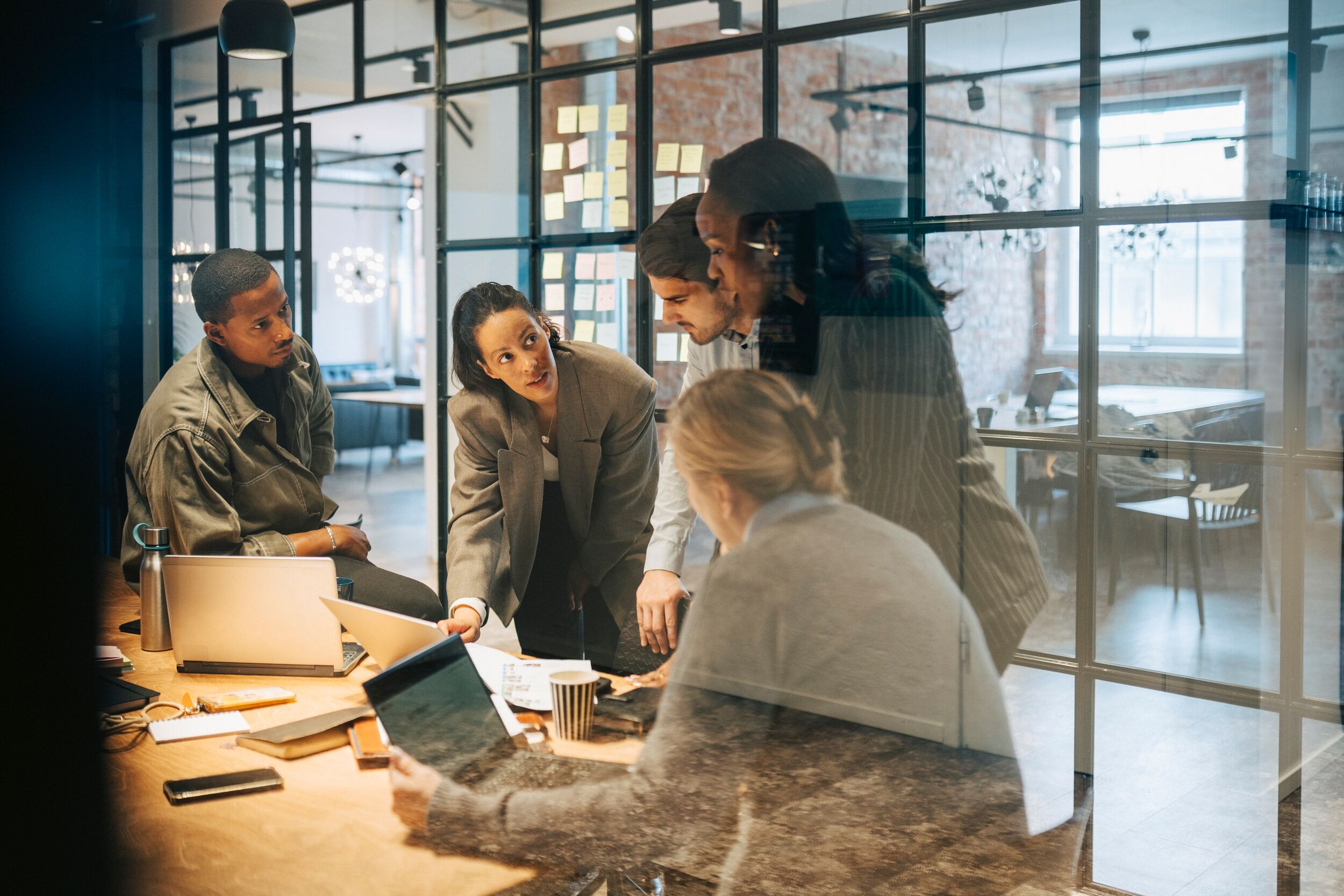 Group of business professionals planning strategies in conference room at office.
