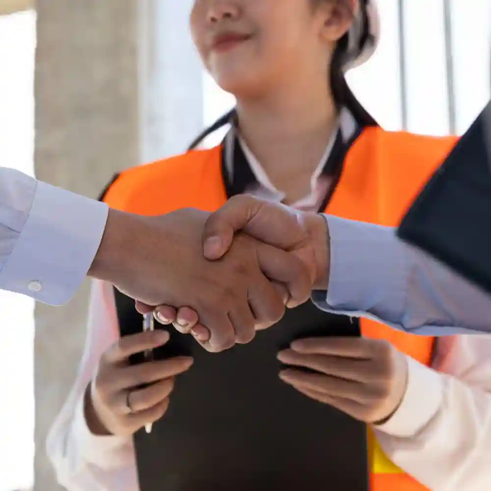 Two people shaking hands.