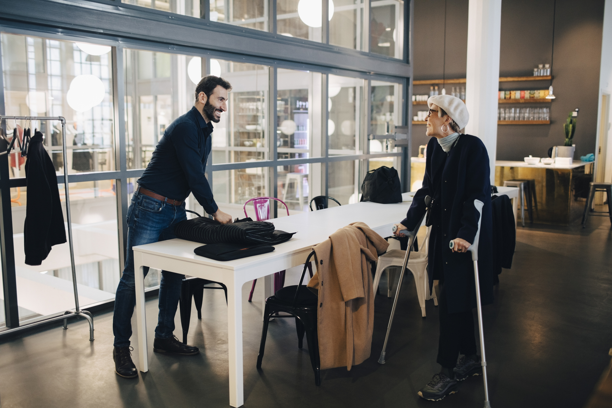 Two corkers sitting in a modern office coffee shop.