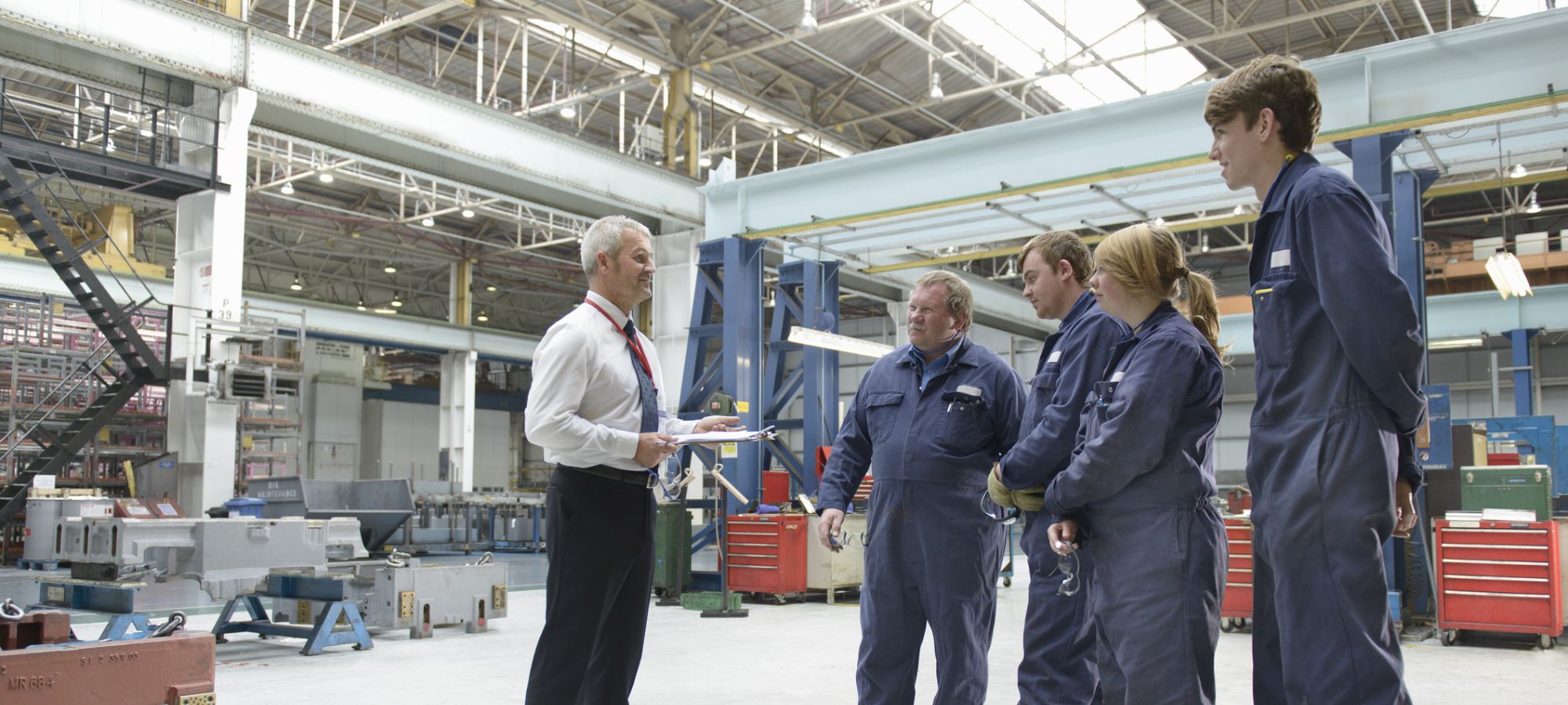 Manager talking to a factory team.